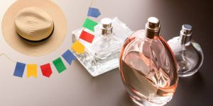 Imagem mostrando elementos de festas juninas ao lado de frascos de perfumes