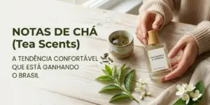 Mão segurando perfume 